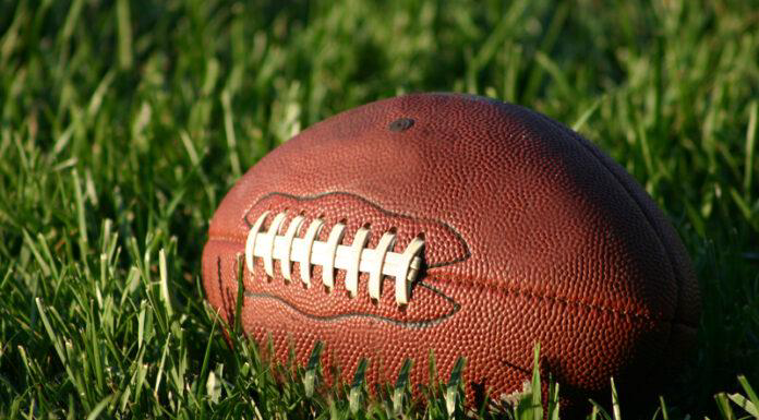 Football on Grass Field