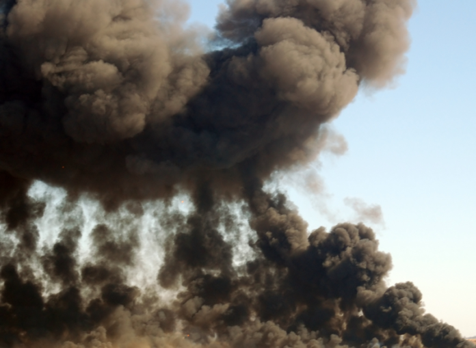 Smoke plume. Rising smoke plme from an explosion